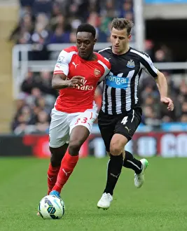 Newcastle United V Arseal 2014/15 Prints: Danny Welbeck vs. Ryan Taylor: Intense Battle in Newcastle United vs