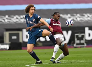 West Ham United V Arsenal 2020-21 Prints: David Luiz vs Michail Antonio: A Battle of Strength in the Intense West Ham United vs Arsenal Premier League Clash