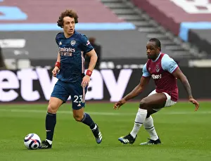 West Ham United V Arsenal 2020-21 Prints: David Luiz vs Michail Antonio: A Battle for Possession in the Premier League Clash between West Ham and Arsenal