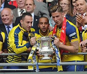 David Ospina, Theo Walcott and Olivier Giroud (Arsenal) lift the FA Cup after the match