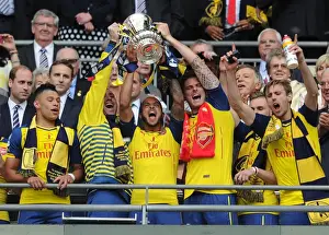 David Ospina, Theo Walcott, Olivier Giroud and Nacho Monreal (Arsenal) lift the FA