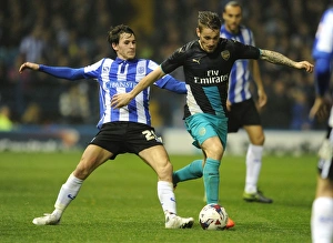 Sheffield Wednesday V Arsenal - Capital One Cup 2015-16 Prints: Debuchy vs. Lee: Arsenal's Defender Clashes With Sheffield Wednesday's Midfielder in Capital One Cup Showdown