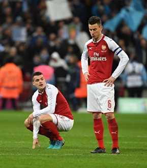 Dejected Duo: Xhaka and Koscielny After Arsenal's Carabao Cup Final Defeat vs Manchester City