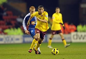 Images Dated 29th December 2010: Denilson (Arsenal) Ben Watson (Wigan). Wigan Athletic 2: 2 Arsenal, DW Stadium
