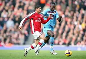Images Dated 31st January 2009: Denilson (Arsenal) Carlton Cole (West Ham)