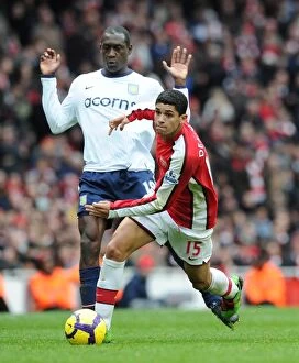 Arsenal v Aston Villa 2009-10 Collection: Denilson (Arsenal) Emile Heskey (Aston Villa). Arsenal 3: 0 Aston Villa