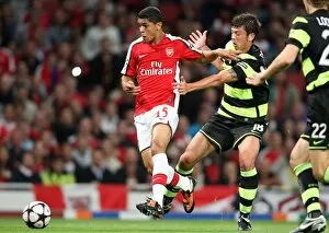 Images Dated 26th August 2009: Denilson (Arsenal) Massimo Donati (Celtic)