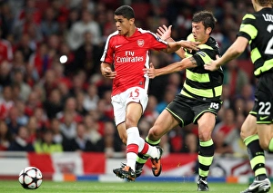 Arsenal v Celtic 2009-10 Collection: Denilson (Arsenal) Massimo Donati (Celtic)
