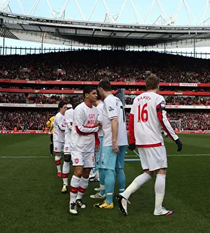 Denilson (Arsenal) shakes hands with Kevin McDonald (Burnley) before the match