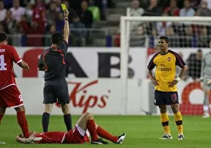 Denilson (Arsenal) is shown the yellow card by referee