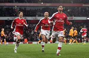 Images Dated 19th December 2009: Denilson celebrates scoring Arsenals 1st goal with Mikael Silvestre and Samir Nasri
