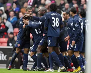 Denilson celebrates scoring Arsenals goal with Armand Traore and Sol Campbell