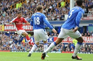 Everton v Arsenal 2009-10 Collection: Denilson shoots past Everton goalkeeper Tim Howard