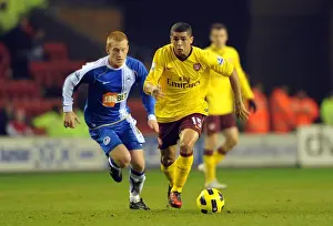 Wigan Athletic V Arsenal 2010-11 Prints: Denilson vs. Ben Watson: Dramatic Draw at DW Stadium - Arsenal vs. Wigan Athletic, 2010