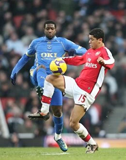 Arsenal v Portsmouth 2008-09 Collection: Denilson vs. Mvuemba: Arsenal's Edge over Portsmouth in the Premier League Showdown at Emirates