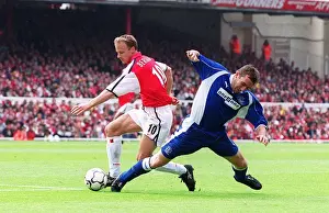 Dennis Bergkamp breaks past Everton defender Alan Stubbs to set up the 2nd Arsenal goal