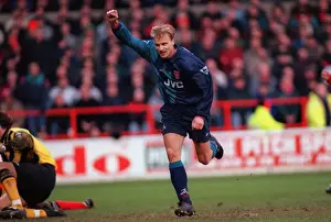 Dennis Bergkamp celebrates scoring for Arsenal against Nottingham Forest