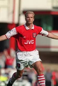 Dennis Bergkamp celebrates scoring his first goal for Arsenal