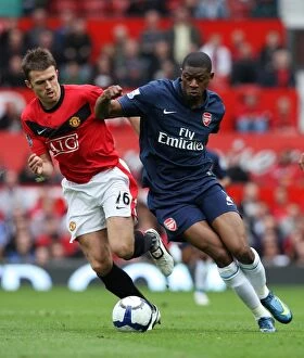 Manchester United v Arsenal 2009-10 Collection: Diaby vs. Carrick: A Tight Battle - Manchester United Edge Past Arsenal 2:1
