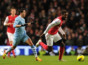 Manchester City V Arsenal 2011-12 Prints: Djourou vs. Nasri: A Premier League Showdown at the Etihad