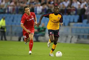 FC Twente V Arsenal Prints: Djourou's Dominance: Arsenal's 2-0 Champions League Triumph over FC Twente's Arnautovic