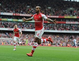 Arsenal v West Bromwich Albion 2014/15 Collection: Dramatic Last-Minute Victory: Theo Walcott's Thrilling Goal for Arsenal vs