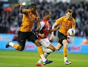 Wolverhampton Wanderers v Arsenal 2011-12 Collection: Dramatic Penalty Showdown: Theo Walcott vs Sebastien Bassong at Wolverhampton Wanderers (2011-12)