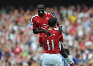 Eboue Emmanuel Collection: Eboue and van Persie: Unstoppable Arsenal Duo Celebrates 4-0 Over Wigan Athletic