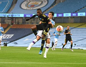 Manchester City V Arsenal 2019-20 Prints: Eddie Nketiah vs Eric Garcia: Intense Battle in Manchester City vs Arsenal FC Premier League Clash (2019-20)