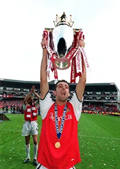 Edu (Arsenal) lifts the F. A. Barclaycard Premiership Trophy