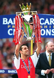 Edu lifts the F. A. Barclaycard Premiership Trophy