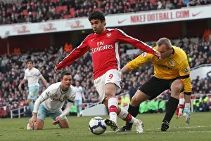Arsenal V Burnley 2009-10 Prints: Eduardo (Arsenal) Brian Jensen and Daniel Fox (Burnley). Arsenal 3: 1 Burnley