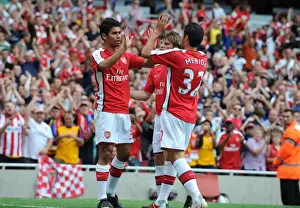 Arshavin Andrey Prints: Eduardo, Arshavin, and Merdia: Unstoppable Arsenal Duo Celebrates 3:0 Victory Over Rangers