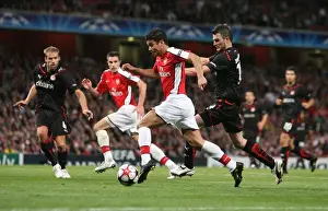 Eduardo breaks past Olympiacos defender Michal Zewlakow