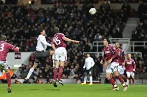 Eduardo heads past Matthew Upson and goalkeeper Rob Green to score the 2nd Arsenal goal