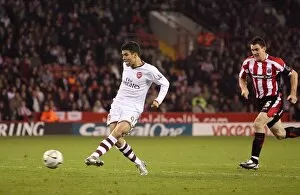 Eduardo scores his and Arsenals 2nd as Chris Morgan (Sheff) chases back