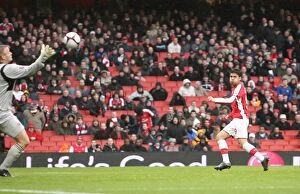Images Dated 8th March 2009: Eduardo shoots past Burnley goalkeeper Brian Jensen