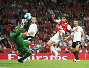 Eduardo shoots past Sparta Prague goalkeeper Tomas Postulka to score the 3rd Arsenal goal Eduardo shoots past Sparta Prague goalkeeper Tomas Postulka to score the 3rd Arsenal goal