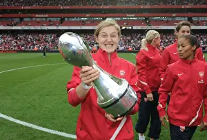 Ellen White's Double Victory: Arsenal's WSL Title Celebration Amidst Premier League Action (2011)