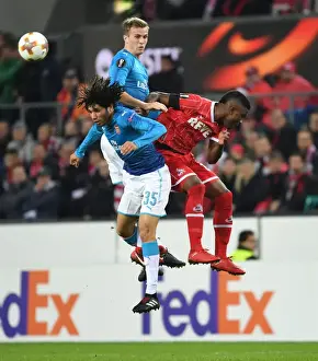 FC Koln V Arsenal 2017-18 Prints: Elneny and Holding Lock Horns with Guirassy in Arsenal's Europa League Battle against FC Koln
