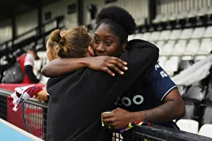 Embrace of Victory: Arsenal Women vs. Aston Villa Women in FA WSL Showdown