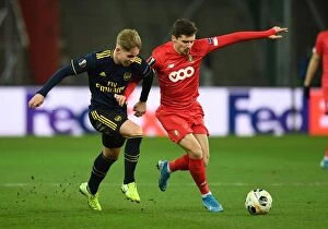 Images Dated 13th December 2019: Emile Smith Rowe Clashes with Gojko Cimirot in Arsenal's UEFA Europa League Battle against