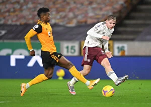 Wolverhampton Wanderers v Arsenal 2020-21 Collection: Emile Smith Rowe Faces Off Against Nelson Semedo: Wolverhampton Wanderers vs Arsenal