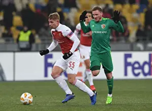 FC Vorskla Poltava V Arsenal 2018-19 Prints: Emile Smith Rowe vs. Oleksandr Skliar: Battle in the Europa League between Vorskla Poltava and Arsenal