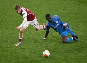 Emile Smith Rowe's Europa League Battle: Arsenal vs. Olympiacos at Empty Emirates Stadium, London, 2021