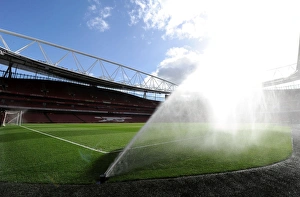 Arsenal Everton 2014-15 Prints: Emirates Stadium: Preparing the Wet Pitch for Arsenal vs. Everton (2014-15)