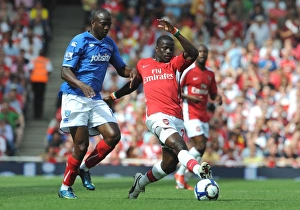 Emmaniuel Eboue (Arsenal) John Utaka (Portsmouth) Emmaniuel Eboue (Arsenal) John Utaka (Portsmouth)
