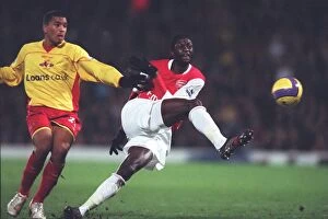 Watford v Arsenal Collection: Emmanuel Adebayor (Arsenal) Adrian Mariappa (Watford)