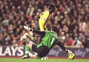 Images Dated 28th February 2006: Emmanuel Adebayor (Arsenal) Jerzy Dudek (Liverpool). Liverpool 1: 0 Arsenal