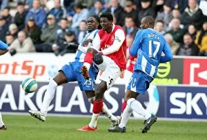 Wigan Athletic v Arsenal 2007-08 Collection: Emmanuel Adebayor (Arsenal) Mario Melchiot and Emmerson Boyce (Wigan)